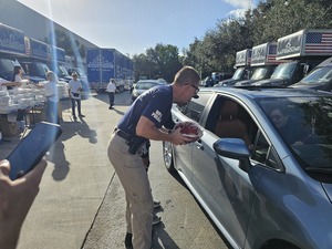 Safebound, WPB PD, and Cotton Bottom Team Up to Distribute Turkeys, Diapers, and Toys to Families