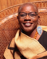 Kianga Jinaki, as featured speaker for November Meeting, “I Speak with Cloth”