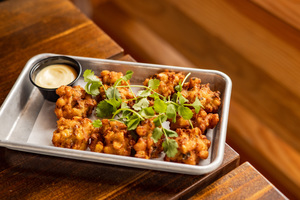 Celebrate National Corn Fritters Day at Loro!