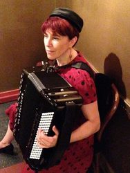 Heather plays accordion at Kopi Cafe