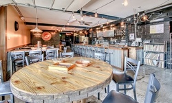 Flight and Pint for One or Two at Crooked Eye Brewery (Up to 32% Off)