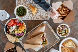 Greek Food and Drink at The Simple Greek  (Up to 42% Off). Two Options Available. 