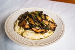Caribbean Food and Drink for Takeout at Sandovan Restaurant & Lounge (Up to 26% Off). Two Options Available.