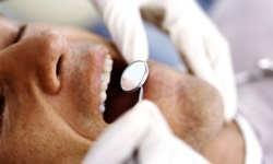 $39.20 for a Dental Package with Exam, Cleaning, and X-rays at Vanguard Dental in Mineola ($450 Value)
