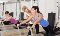 Pilates Reformer Classes or Private Lessons at Pilates Studio West (Up to 65% Off). Four Options Available.