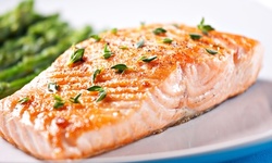 $17 for Baked Salmon with Two Sides, Corn Bread, and Drink at Texas Rotisserie and Grill ($20.95 Value)