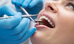 In-Office Zoom! Teeth-Whitening Treatment or Exam with X-Rays and Photos at Encino Dental Center (Up to 88% Off)