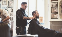Men's Haircut and Shampoo with Optional Hot Towel Treatment and Color at Dolls n Guys Hair Salon (Up to 59% Off)