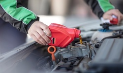 Semi- or Full-Synthetic Oil Change Package with Optional Tire Rotation at 2 Quick Automotive (Up to 50% Off)