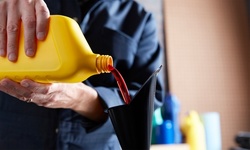 Oil Change with Tire Rotation and Safety Inspection at Lambros Center (Up to 52% Off). Two Options Available.