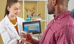 Dental Exam, X-Ray, Cleaning, Teeth Whitening, Retainer, More at United Dental Group (Up to 90% Off). 8 Options.