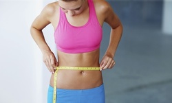 Two, Four, or Six Noninvasive 3D Tummy Lipo and Vac-Lipo Treatments at Natural Beauty Clinique (Up to 89% Off)