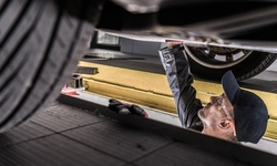 Four-Wheel Alignment at Denison Auto Care (Up to 44% Off). Two Options Available.