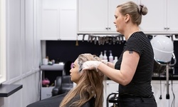 Haircut w/ Optional Deep-Conditioning Treatment & Root Touchup at Rollins Hair and Color Studio (Up to 64% Off)
