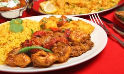 Indian Food and Drink for Takeout and Dine-In if Available at Curry & Spice Bar (Up to 50% Off). Two Options.