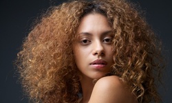 Full Head Foil Highlight or One Color Retouch at Hair By Angie (Up to 53% Off)