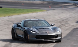 Three- or Six-Lap Drive in a Corvette Z06 Racecar from The American Muscle Experience (Up to 50% Off)