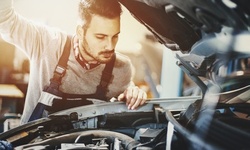 Oil Change or A/C Recharge at Uptown Motors (Up to 50% Off). Three Options Available.