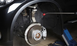 Brake-Pad Service for Front and Optional Rear Brakes at Motion Lube Center (Up to 33% Off)