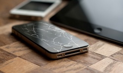 iPhone or iPad Screen Repair or Battery Replacement at Cosmo Repair (Up to 52% Off). 16 Options Available.