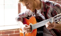 $4 for an Online Beginners Guitar Lessons from SkillSuccess eLearning ($199 Value)   