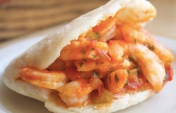 $3.50 for $5 Toward Food and Drink or Four Full Christmas Plates for Takeout or Dine-In at Arepas Grill