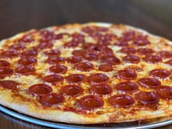 1 Milkshake or 1 Large Cheese Pizza, 12 Garlic Knots, and 1 Caesar Salad at Mike's Pizza (Up to 79% Off)