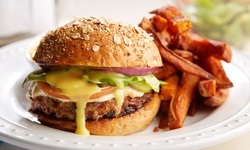 $9.72 for $25 Worth of Upscale Pub Food and Drinks for Dine-in for Two at Ron's Place 