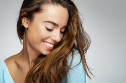 Haircut with Condition, Blow-Dry, and Optional Color or Root Touchup at The Hair Tailors (Up to 61% Off)