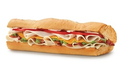 One or Two Regular Sandwiches, Bags of Chips and Medium Drinks at Quiznos (Up to 38% Off)