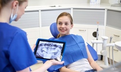 Dental Exam, X-Ray, and Cleaning for Child or Adult at Smile Saver Dental Group (Up to 90% Off)