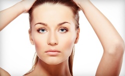 One or Two Facial Area Fraxel Laser Treatments for the Face at StudioMD - Long Island (83% Off)