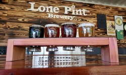Glasses of Beer or Tasting Flights with Coozies at Lone Pint Brewery (Up to 55% Off). 4 Options Available.