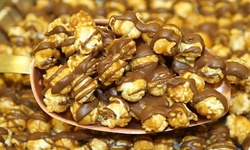 One or Three vouchers, Each Good for $10 Worth of Gourmet Popcorn at Just Poppin Gourmet Popcorn