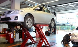 Brake Pad Replacement or Tire Balancing and Installation at Mid City Complete Auto (Up to 60% Off).