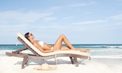One or Two Tanning Sessions or One Month of Red-Light Therapy Sessions at The Tanning Spot (80% Off) 